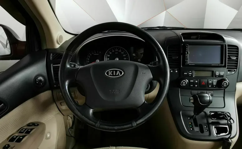 Kia Carnival 2.7 AT (186 л.с.) Красный