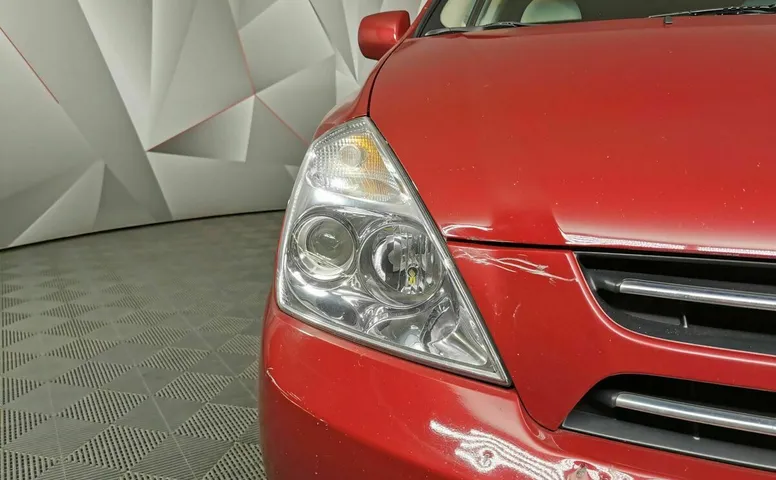Kia Carnival 2.7 AT (186 л.с.) Красный